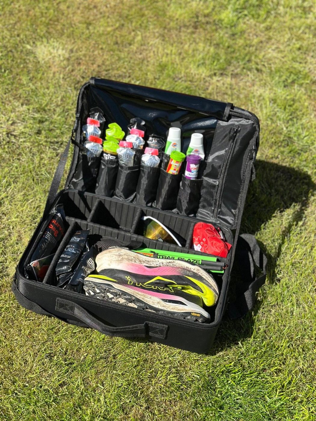 MYVICI bag open outdoors with running kit inside