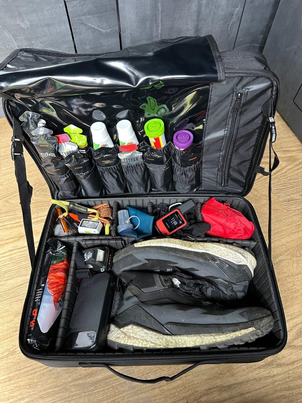 MYVICI bag packed with shoes, nutrition and adventure kit